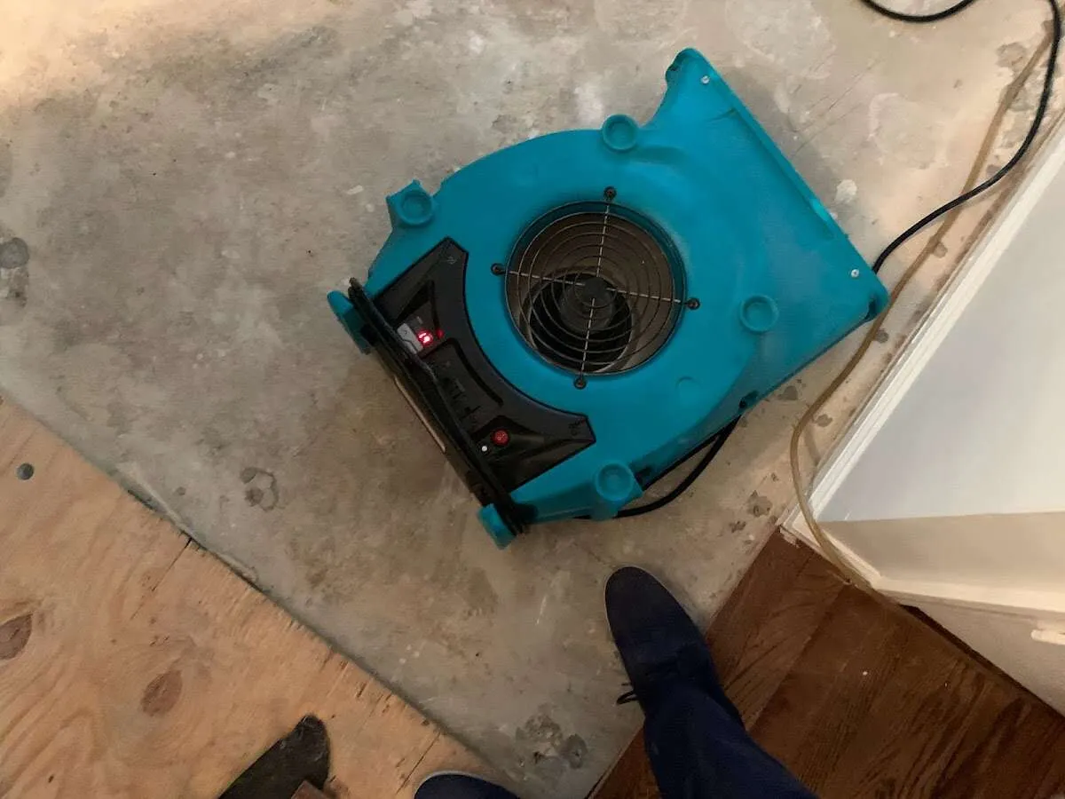 Air mover drying subfloor during Leak Detection & Repair in Conshohocken